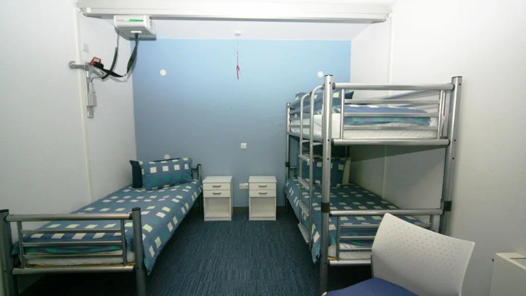 Bedroom with bunk bed and single bed.